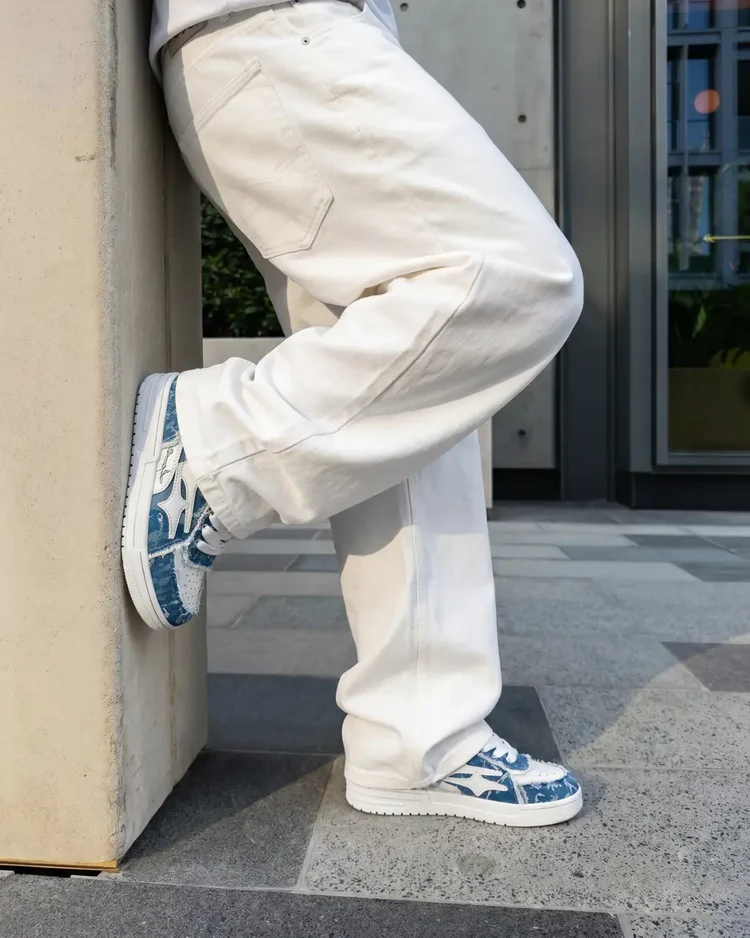 Sky Blue sneakers leaning on wall